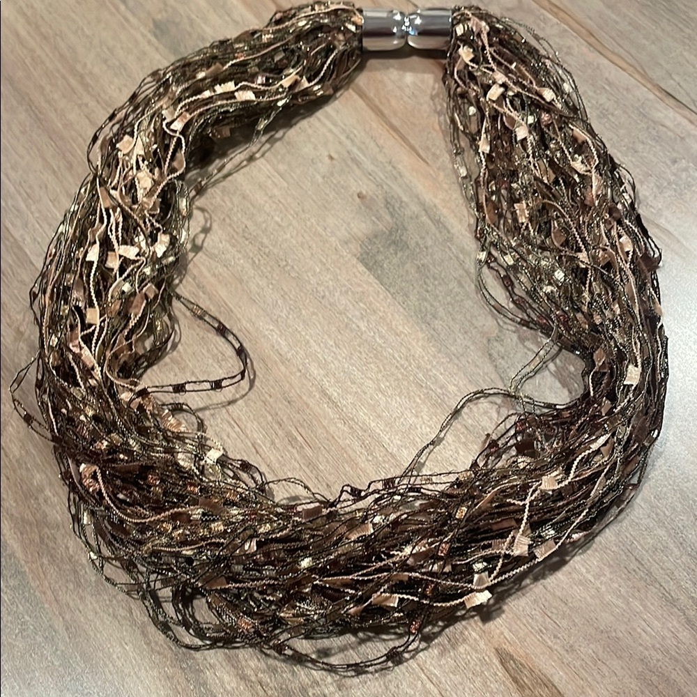Brown Multi-Strand Necklace with Layered Appearance and Medium Length